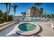 Beautiful community pool and hot tub with waterfront views and lush landscaping at 690 Island Way # 404, Clearwater Beach, FL 33767