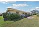 Spacious backyard featuring a well-maintained lawn and patio at 7245 Wood Creek Dr # 29, Sarasota, FL 34231