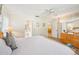 Bedroom with a ceiling fan, en-suite bathroom, wood dresser and natural light at 7245 Wood Creek Dr # 29, Sarasota, FL 34231