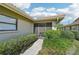 A welcoming entrance with a well-manicured green lawn and beautiful landscaping at 7245 Wood Creek Dr # 29, Sarasota, FL 34231