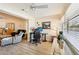 Open living room and home office area with wood-look floors and lots of light at 7245 Wood Creek Dr # 29, Sarasota, FL 34231