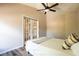 Bedroom featuring French doors with a view to the open area and a comfortable bed at 732 June Lake Ln, Brandon, FL 33510