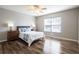 Bright bedroom with wood floors and a large window offering natural light and a comfortable space at 732 June Lake Ln, Brandon, FL 33510