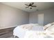 Bright bedroom featuring a ceiling fan and wood flooring at 732 June Lake Ln, Brandon, FL 33510