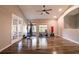 Spacious exercise room with wood flooring and a variety of exercise equipment at 732 June Lake Ln, Brandon, FL 33510