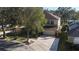 Two-story home on a corner lot featuring mature trees, a large driveway and a two car garage at 732 June Lake Ln, Brandon, FL 33510
