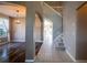 Welcoming hallway connects living spaces with arched entryways and features staircase access to upper level at 732 June Lake Ln, Brandon, FL 33510
