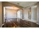 Spacious living room boasts hardwood floors, arched entryways, and natural light throughout at 732 June Lake Ln, Brandon, FL 33510