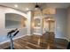 Loft area with dark wood floors, high ceilings with arched details and a view of the home at 732 June Lake Ln, Brandon, FL 33510