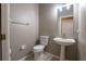 Powder room with neutral color palette and pedestal sink at 732 June Lake Ln, Brandon, FL 33510