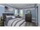 Calming bedroom features a large bed, neutral-toned bedding, and natural light from the window at 8621 Snowfall St, Sarasota, FL 34241