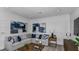 Comfortable living room featuring a sectional sofa, accent pillows, and recessed lighting for cozy gatherings at 8621 Snowfall St, Sarasota, FL 34241