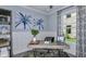 Bright office with a large window, modern desk, and shelving for an organized, productive workspace at 8621 Snowfall St, Sarasota, FL 34241