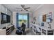 Versatile study with built-in desks, contemporary decor, and plenty of natural light at 8621 Snowfall St, Sarasota, FL 34241