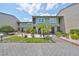 Charming condo with a well-maintained brick drive and lush landscaping at 1028 Apollo Beach Blvd # 13, Apollo Beach, FL 33572