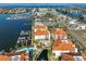 Aerial view of condo complex with marina, located directly on the water with lush landscaping and community pool at 1030 Bellasol Way # 302, Apollo Beach, FL 33572