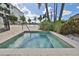 Community hot tub surrounded by pavers and green plants, set near the community swimming pool at 1030 Bellasol Way # 302, Apollo Beach, FL 33572