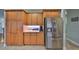 Kitchen area with a large stainless steel refrigerator and lots of cabinet space at 1030 Bellasol Way # 302, Apollo Beach, FL 33572