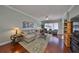 Comfortable living room featuring hardwood floors, soft lighting, and stylish decor with a serene ambiance at 1030 Bellasol Way # 302, Apollo Beach, FL 33572