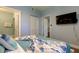 Cozy bedroom featuring a TV, closet, and ensuite bathroom, perfect for relaxation and convenience at 10764 70Th Ave # 2110, Seminole, FL 33772
