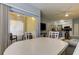 View from dining table into kitchen and living room at 10764 70Th Ave # 2110, Seminole, FL 33772