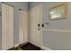 Entry way with laminate flooring, bi-fold closet door, and door with secure entry system at 10764 70Th Ave # 2110, Seminole, FL 33772