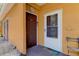 A condo entrance with a brown door and a storm door at 10764 70Th Ave # 2110, Seminole, FL 33772