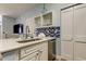 Kitchen with quartz countertops and stainless steel dishwasher, sink and faucet at 10764 70Th Ave # 2110, Seminole, FL 33772