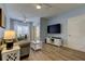 Comfortable living area with wood floors, a ceiling fan, and a sliding glass door at 10764 70Th Ave # 2110, Seminole, FL 33772