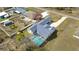 Aerial view of a Gathering home featuring a pool, long driveway and mature landscaping at 11040 Flicker Rd, Brooksville, FL 34613