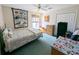Cozy bedroom with ceiling fan, and a window providing natural light at 11040 Flicker Rd, Brooksville, FL 34613
