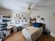 Bedroom featuring a ceiling fan, hardwood floors, and a desk at 11040 Flicker Rd, Brooksville, FL 34613