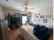 Spacious bedroom featuring a ceiling fan, hardwood floors, and a built-in entertainment center at 11040 Flicker Rd, Brooksville, FL 34613