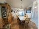 Bright dining room with a large wooden table and a classic china cabinet at 11040 Flicker Rd, Brooksville, FL 34613