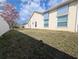 The exterior side of the house includes awnings over the windows and a vinyl fence at 11040 Flicker Rd, Brooksville, FL 34613