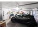 Organized two-car garage space features a car and storage shelving at 11040 Flicker Rd, Brooksville, FL 34613