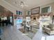 Open floor plan with views into the living room and dining area, and access to the pool at 11040 Flicker Rd, Brooksville, FL 34613