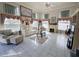 Spacious living room with high ceilings, large windows, and a decorative fireplace at 11040 Flicker Rd, Brooksville, FL 34613