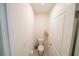 Clean half bathroom features a standard toilet, light walls, and storage at 11517 Koti Creek Ln, Thonotosassa, FL 33592