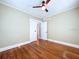 Bedroom featuring hardwood floors, neutral walls, and a ceiling fan at 1276 Sedeeva N Cir, Clearwater, FL 33755