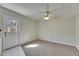 Bedroom with carpet and natural light from an exterior door at 1370 70Th N St # 2-1382, St Petersburg, FL 33710