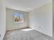 Bright bedroom featuring a large window, plush carpeting and neutral walls at 1370 70Th N St # 2-1382, St Petersburg, FL 33710