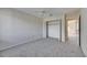 Bright bedroom features neutral carpet and a closet, offering great storage at 1370 70Th N St # 2-1382, St Petersburg, FL 33710
