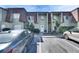 Townhome exterior showcasing manicured landscaping, private entrances, and a convenient parking area at 1370 70Th N St # 2-1382, St Petersburg, FL 33710