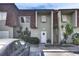 Well-maintained townhome with a welcoming facade and front door adorned with a wreath at 1370 70Th N St # 2-1382, St Petersburg, FL 33710