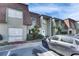 Charming townhome featuring unique architectural details, including a steeply pitched roof and inviting entryway at 1370 70Th N St # 2-1382, St Petersburg, FL 33710