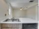 Kitchen featuring stainless steel sink, dishwasher, and a view into the adjacent living area at 1370 70Th N St # 2-1382, St Petersburg, FL 33710