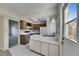 Traditional kitchen with white countertops and appliances and brown wooden cabinetry at 1370 70Th N St # 2-1382, St Petersburg, FL 33710