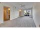 Airy main bedroom features a ceiling fan, large window, and neutral carpet at 1370 70Th N St # 2-1382, St Petersburg, FL 33710