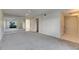 Bright, carpeted main bedroom featuring a ceiling fan, mirrored wall, and natural light at 1370 70Th N St # 2-1382, St Petersburg, FL 33710